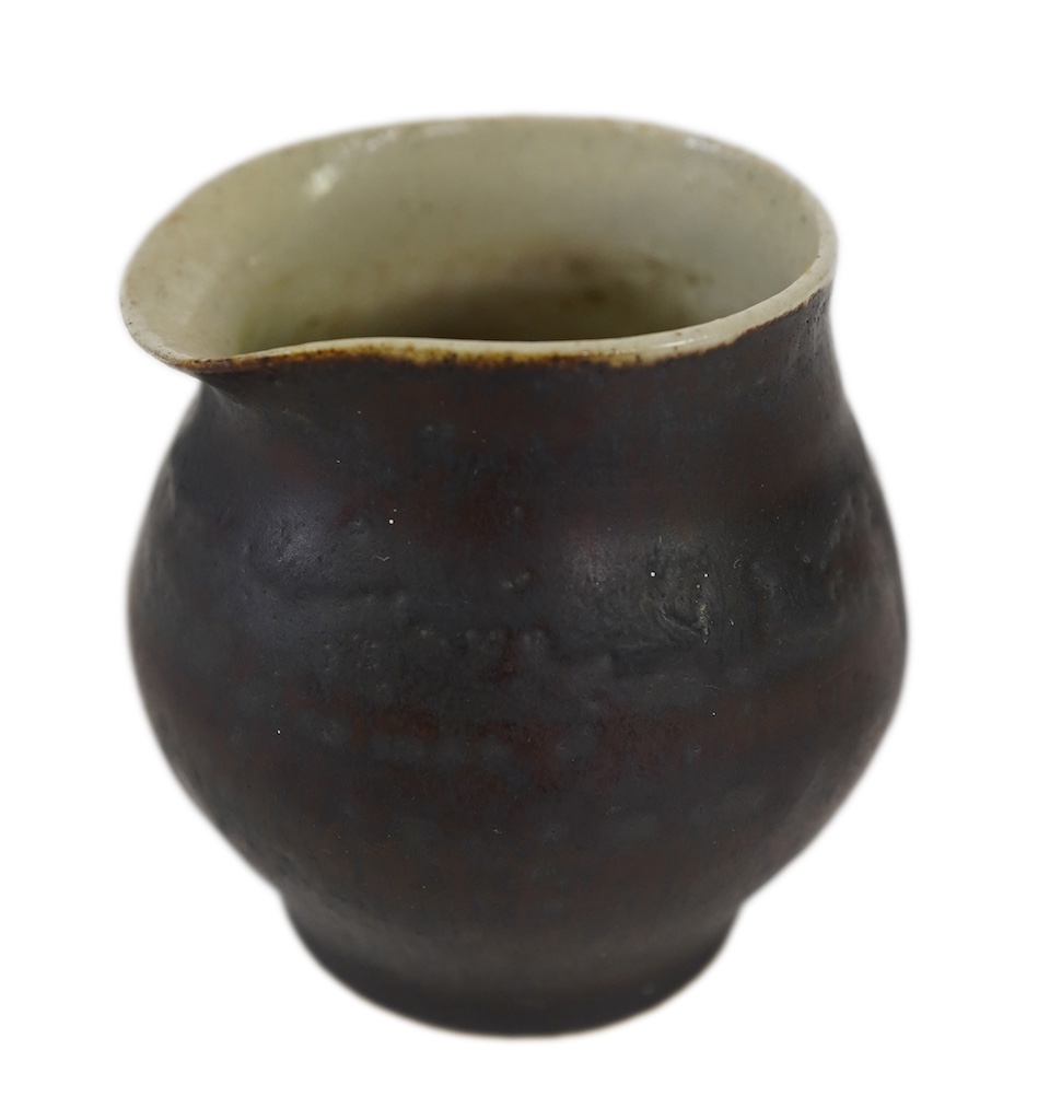 Dame Lucie Rie DBE (Austrian/British, 1902-1995): A stoneware pourer